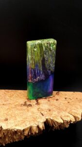 This image portrays Luminescent Dynavap Case - Elm Burl/Resin Hybrid by Dovetail Woodwork.