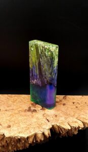 This image portrays Luminescent Dynavap Case - Elm Burl/Resin Hybrid by Dovetail Woodwork.