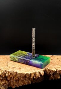 This image portrays Luminescent Dynavap Case - Elm Burl/Resin Hybrid by Dovetail Woodwork.