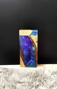 This image portrays Luminescent Galaxy River Stash - Dynavap/Live Edge Hybrid by Dovetail Woodwork.