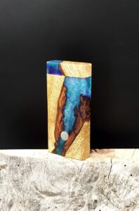 This image portrays Luminescent Galaxy River Stash - Dynavap/Live Edge Hybrid by Dovetail Woodwork.
