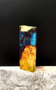 This image portrays Luminescent Dynavap XL Case - Cottonwood Burl/Resin Hybrid by Dovetail Woodwork.