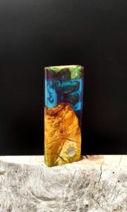 This image portrays Luminescent Dynavap XL Case - Cottonwood Burl/Resin Hybrid by Dovetail Woodwork.