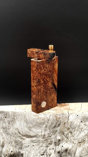 This image portrays Case for Dynavap - Black Walnut Burl/Resin Hybrid by Dovetail Woodwork.