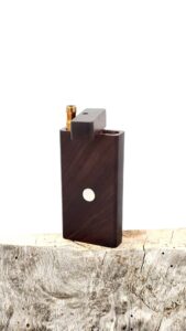 This image portrays Dynavap Case(Dugout)-Brazilian Rosewood by Dovetail Woodwork.