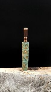 This image portrays Octagon Galaxy Burl (Aqua) Dynavap Midsection by Dovetail Woodwork.