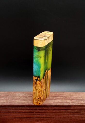 This image portrays Luminescent Cosmic Burl Dynavap Stash Case by Dovetail Woodwork.