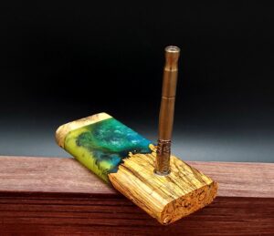 This image portrays Luminescent Cosmic Burl Dynavap Stash Case by Dovetail Woodwork.