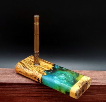 This image portrays Luminescent Cosmic Burl Dynavap Stash Case by Dovetail Woodwork.