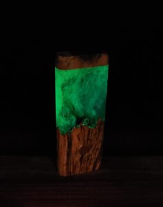 This image portrays Luminescent Cosmic Burl Dynavap Stash Case by Dovetail Woodwork.