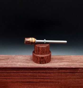 This image portrays Dynavap Spinning Mouthpiece-Bacote Wood by Dovetail Woodwork.