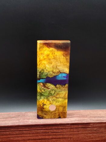 This image portrays Luminescent Cosmic Burl Dynavap Stash by Dovetail Woodwork.