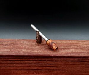 This image portrays Dynavap Spinning Mouthpiece-Thuya Burl by Dovetail Woodwork.