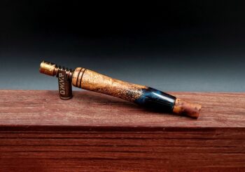 This image portrays Dynavap Spinning Mouthpiece-Thuya Burl by Dovetail Woodwork.