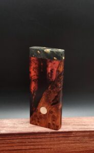 This image portrays Luminescent Hybrid Burl Dynavap Stash Case by Dovetail Woodwork.