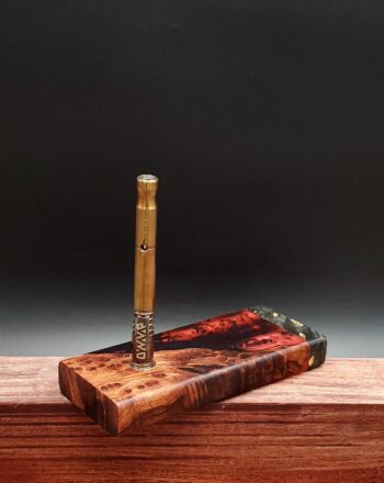 This image portrays Luminescent Hybrid Burl Dynavap Stash Case by Dovetail Woodwork.