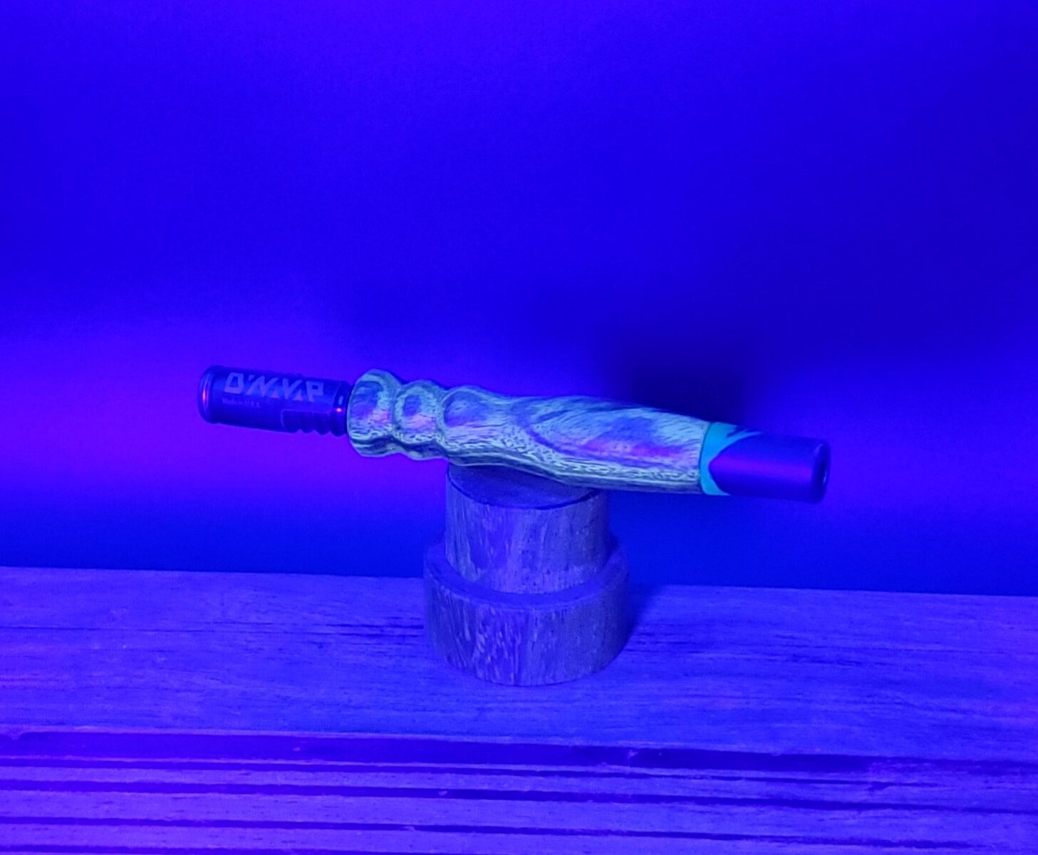 This image portrays Stem Upgrade for Dynavap-Curupau Wood-UV Light Reactive! by Dovetail Woodwork.