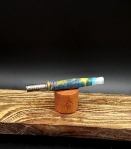 This image portrays Luminescent Dynavap Spinning Mouthpiece-Cosmic Resin by Dovetail Woodwork.