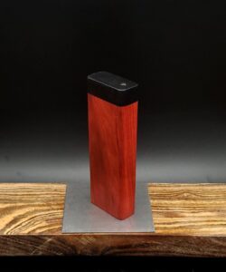 This image portrays Dynavap Quick Stash-Redheart/Ebony wood by Dovetail Woodwork.