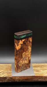 This image portrays Luminescent Cosmic Burl-Dynavap Stash Case by Dovetail Woodwork.