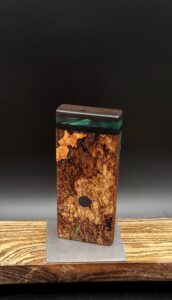 This image portrays Luminescent Cosmic Burl-Dynavap Stash Case by Dovetail Woodwork.