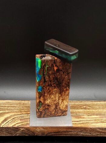 This image portrays Luminescent Cosmic Burl-Dynavap Stash Case by Dovetail Woodwork.