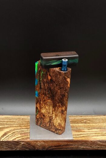 This image portrays Luminescent Cosmic Burl-Dynavap Stash Case by Dovetail Woodwork.