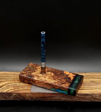 This image portrays Luminescent Cosmic Burl-Dynavap Stash Case by Dovetail Woodwork.