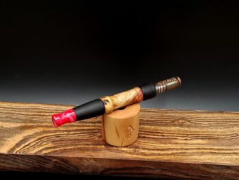 This image portrays Dynavap Spinning Mouthpiece-Cosmic Pink by Dovetail Woodwork.