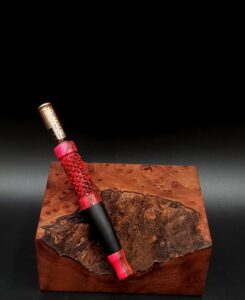 This image portrays Dynavap Spinning Mouthpiece-Black/Pink by Dovetail Woodwork.