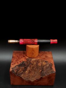This image portrays Dynavap Spinning Mouthpiece-Black/Pink by Dovetail Woodwork.
