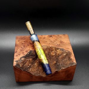 This image portrays Luminescent Cosmic Burl Series XL Hybrid-Dynavap Stem by Dovetail Woodwork.