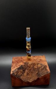 This image portrays Luminescent Galactic Burl XL Hybrid-Dynavap Stem by Dovetail Woodwork.