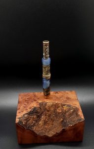 This image portrays Luminescent Galactic Burl XL Hybrid-Dynavap Stem by Dovetail Woodwork.