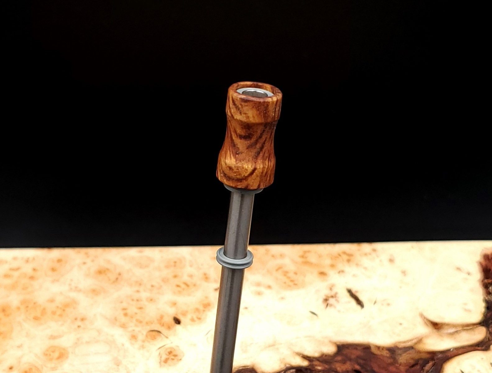 This image portrays Dynavap Spinning Mouthpiece-Golden Striped Amboyna Burl by Dovetail Woodwork.