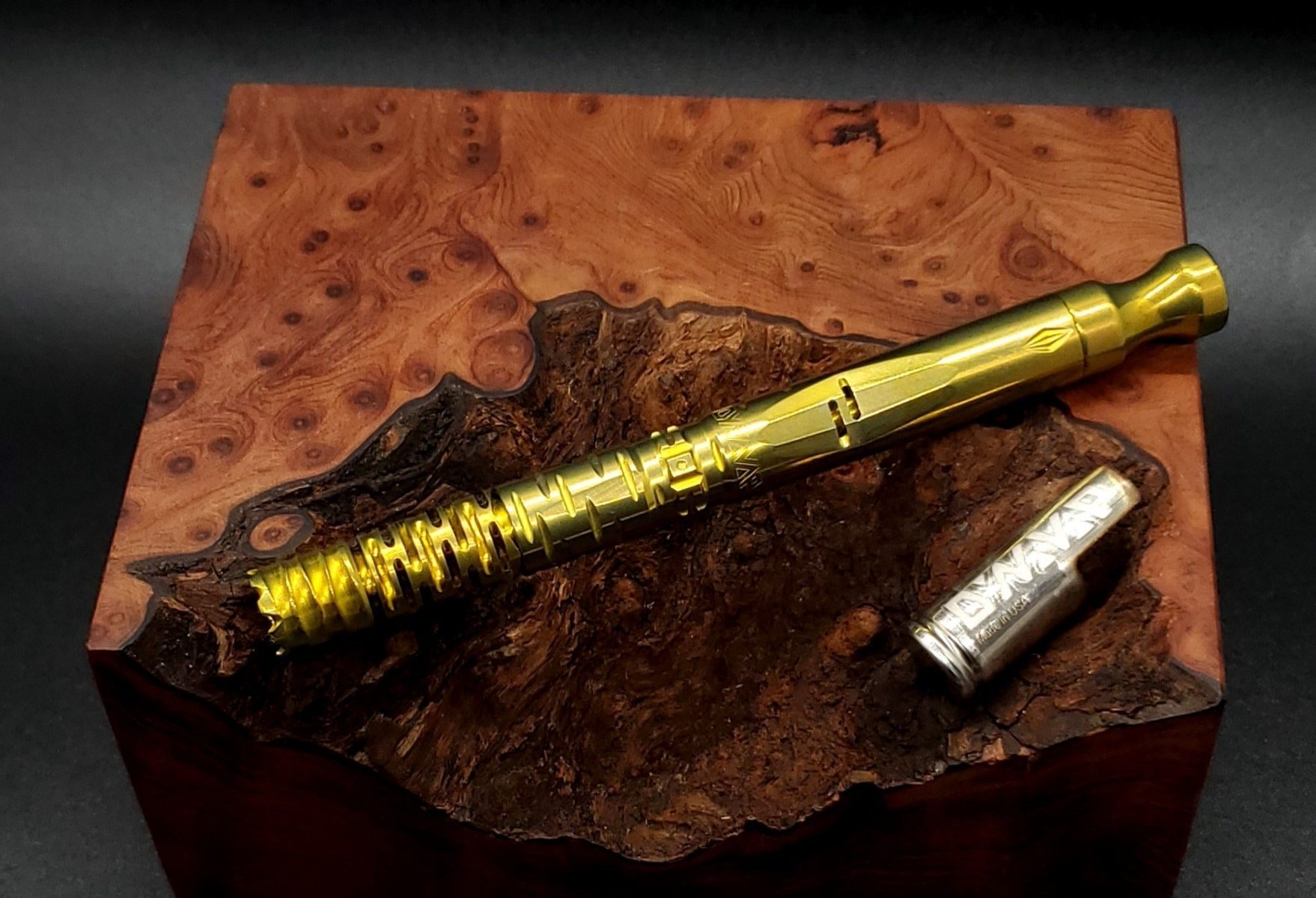 This image portrays Gold Anodized Titanium Omni-Dynavap-Full Stem by Dovetail Woodwork.
