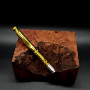 This image portrays Gold Anodized Titanium Omni-Dynavap-Full Stem by Dovetail Woodwork.