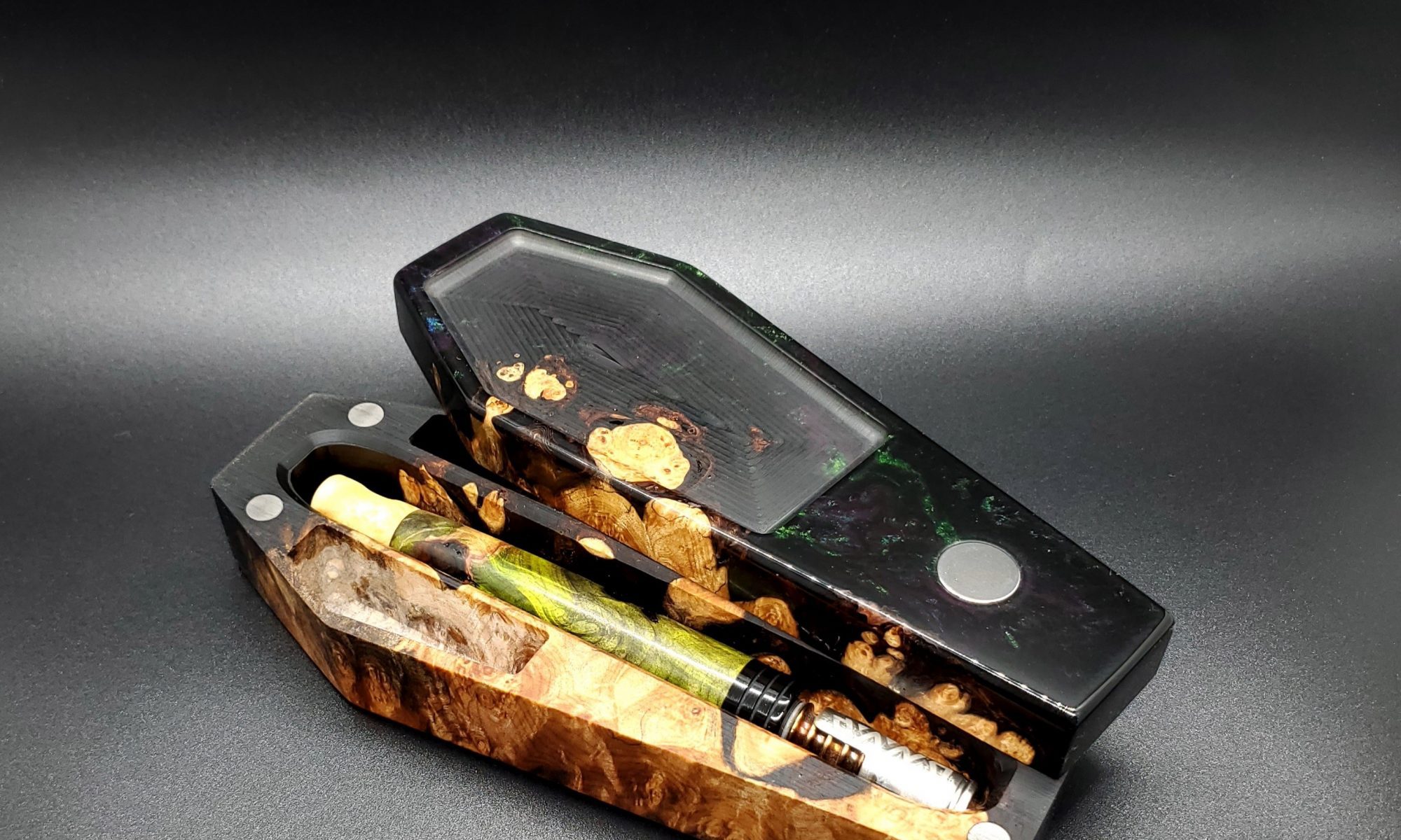 This image portrays Dynavap Coffin Case-Maple Burl Hybrid by Dovetail Woodwork.