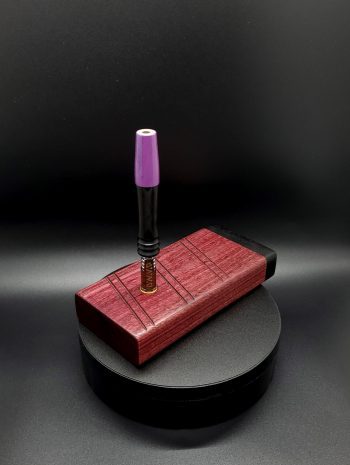 This image portrays 2G-XL Stash-Purpleheart/Ebony Wood-Dynavap Case by Dovetail Woodwork.