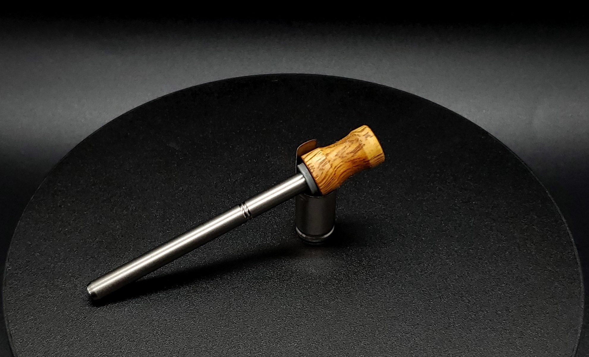 This image portrays Dynavap Spinning Mouthpiece-Highly Grained Amboyna Burl by Dovetail Woodwork.