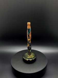 This image portrays Luminescent Cosmic Series-Buckeye Burl Hybrid-XL Dynavap Stem by Dovetail Woodwork.