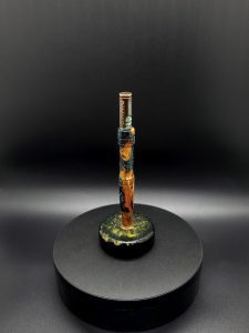 This image portrays Luminescent Cosmic Series-Buckeye Burl Hybrid-XL Dynavap Stem by Dovetail Woodwork.