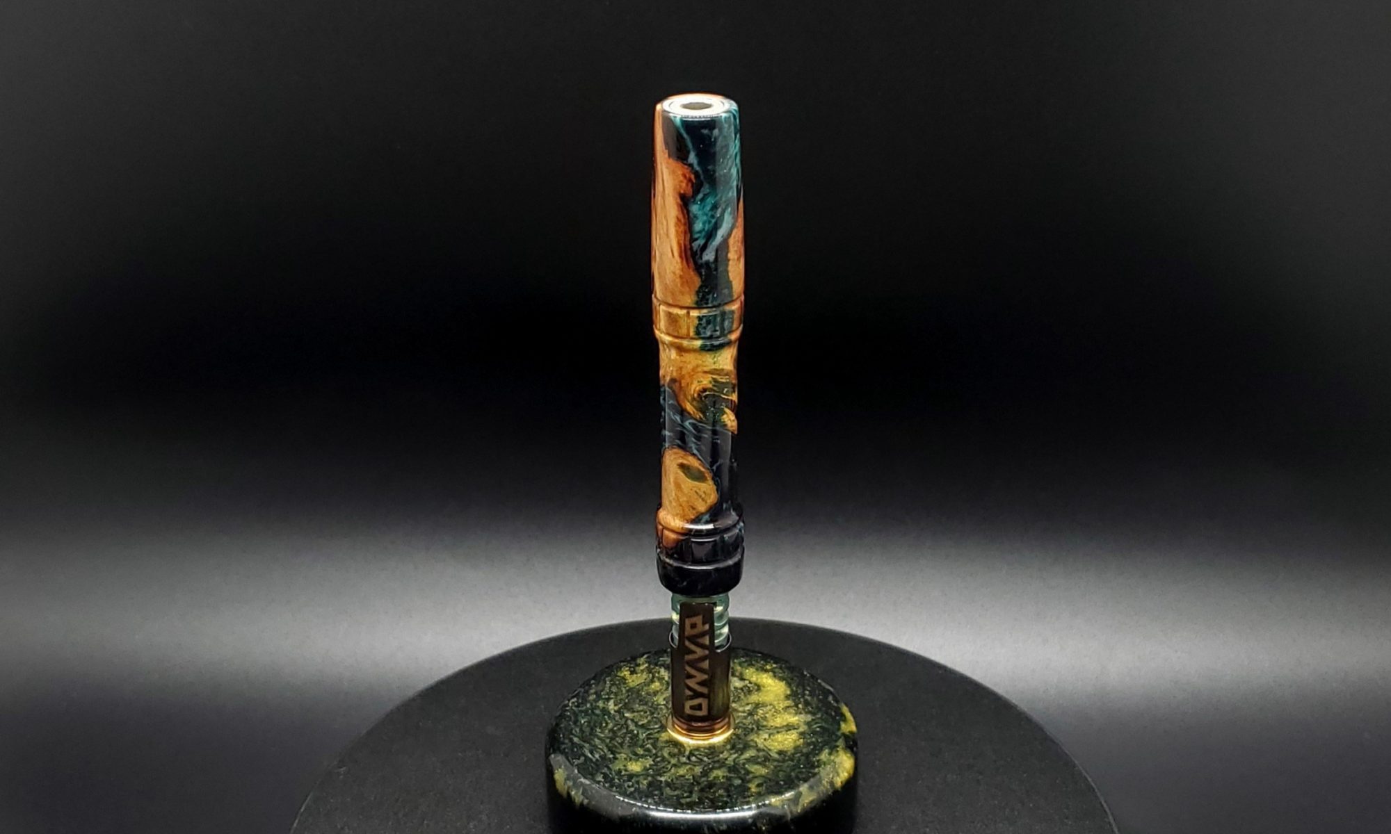 This image portrays Luminescent Cosmic Series-Buckeye Burl Hybrid-XL Dynavap Stem by Dovetail Woodwork.