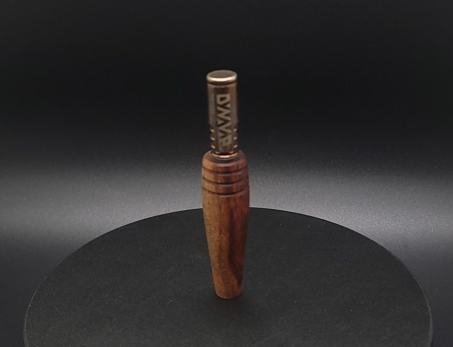This image portrays Dynavap Shotgun Stem-Caribbean Rose Wood by Dovetail Woodwork.