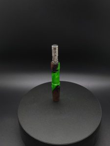 This image portrays Twisted Series-Cosmic Green Hybrid-XL Dynavap Stem by Dovetail Woodwork.