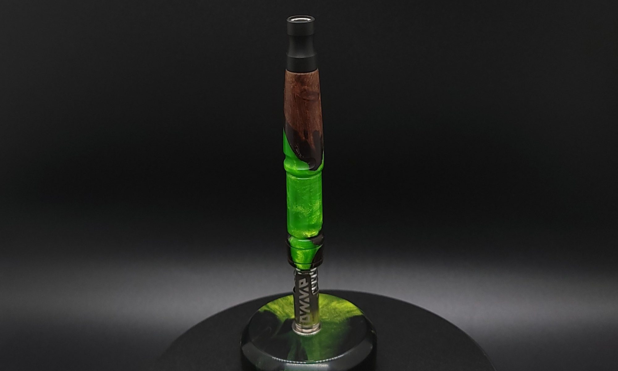 This image portrays Twisted Series-Cosmic Green Hybrid-XL Dynavap Stem by Dovetail Woodwork.