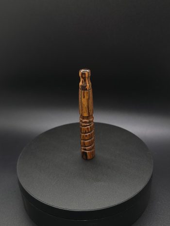 This image portrays Dynavap Spinning Mouthpiece-Bocote Wood by Dovetail Woodwork.