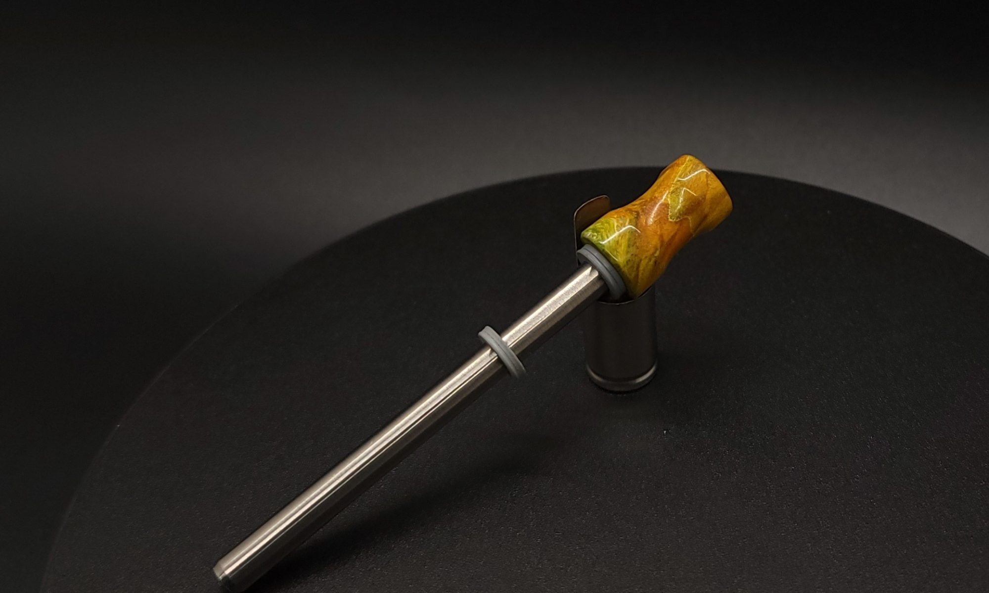 This image portrays Dynavap Spinning Mouthpiece-Sunset Orange/Green Cosmic Burl by Dovetail Woodwork.