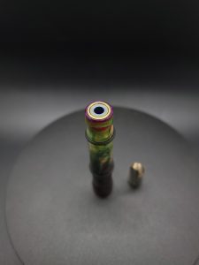 This image portrays Slim Profile XL-Buckeye Burl Rosium/Gold Anodized Titanium-Dynavap Stem by Dovetail Woodwork.