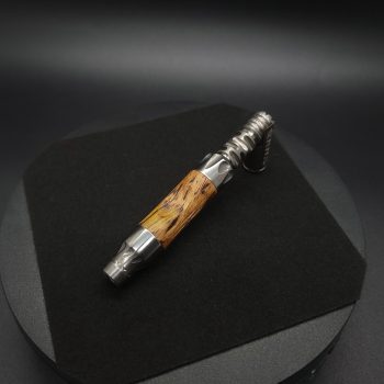 This image portrays Vong(i) Custom Sleeve-Golden Striped Amboyna Burl by Dovetail Woodwork.